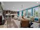 Open-concept living area with a kitchen, living room, and dining area, all with modern decor at 1103 Capstone Dr, Durham, NC 27713