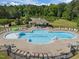 Community pool featuring ample seating, covered area, and well maintained grounds at 1103 Capstone Dr, Durham, NC 27713