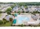 Community pool area with lap lanes, lounge chairs, and nearby residential homes at 1104 Dominion Hill Dr, Cary, NC 27519