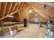 Unfinished attic space with exposed wooden beams offering potential for customization and storage at 1104 Dominion Hill Dr, Cary, NC 27519