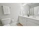 Bathroom offers dual sinks, white cabinetry, and a tile floor at 1104 Dominion Hill Dr, Cary, NC 27519