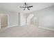 Bedroom features neutral carpet, a ceiling fan, a double door closet, and a window at 1104 Dominion Hill Dr, Cary, NC 27519
