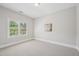 Bedroom offers neutral carpet and white trim, with natural light from the window at 1104 Dominion Hill Dr, Cary, NC 27519