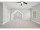 Bedroom features neutral carpet, a ceiling fan, a double door closet, and natural light at 1104 Dominion Hill Dr, Cary, NC 27519