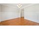 Bright dining room with hardwood floors, wainscoting, and classic chandelier at 1104 Dominion Hill Dr, Cary, NC 27519