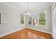 Inviting dining room with hardwood floors, natural light, and neutral paint at 1104 Dominion Hill Dr, Cary, NC 27519