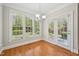Sunlit dining area features hardwood floors and outdoor access at 1104 Dominion Hill Dr, Cary, NC 27519
