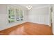 Elegant dining room with wainscoting, hardwood floors, and a chandelier for a classic and sophisticated look at 1104 Dominion Hill Dr, Cary, NC 27519