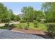 Landscaped front yard enhances curb appeal and offers a welcoming entrance to the home at 1104 Dominion Hill Dr, Cary, NC 27519