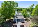 Scenic gazebo overlooking a serene lake surrounded by lush greenery and mature trees at 1104 Dominion Hill Dr, Cary, NC 27519