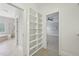 Hallway features convenient built-in shelving and access to a well-appointed bathroom and bedroom at 1104 Dominion Hill Dr, Cary, NC 27519
