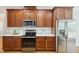 Modern kitchen featuring stainless steel appliances and ample counter space at 1104 Dominion Hill Dr, Cary, NC 27519