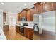 Well-equipped kitchen showcasing wood cabinets and stainless steel refrigerator at 1104 Dominion Hill Dr, Cary, NC 27519