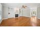 Bright and spacious living room featuring a fireplace with built-ins, hardwood floors, and ample natural light at 1104 Dominion Hill Dr, Cary, NC 27519