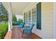 Inviting porch with rocking chairs and porch swing, offering a perfect spot for relaxation and enjoying the outdoors at 1104 Dominion Hill Dr, Cary, NC 27519