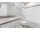 Bathroom with granite countertop vanity, bathtub, and tiled shower at 114 Cross Country Way, Durham, NC 27703