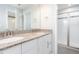Bathroom with granite countertop vanity featuring double sinks and separate shower with glass doors at 114 Cross Country Way, Durham, NC 27703
