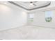 Spacious bedroom featuring a tray ceiling, recessed lighting, and plush carpet at 114 Cross Country Way, Durham, NC 27703