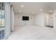 Finished basement featuring a walkout to the backyard, recessed lights, and mounted TV at 114 Cross Country Way, Durham, NC 27703