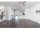Open concept living space with hardwood floors leading into a bright kitchen area at 114 Cross Country Way, Durham, NC 27703