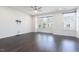Spacious living room features dark hardwood flooring, recessed lighting, and bright windows at 114 Cross Country Way, Durham, NC 27703