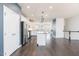 Spacious open floor plan connecting the kitchen, dining, and living areas with hardwood floors at 114 Cross Country Way, Durham, NC 27703
