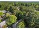 An aerial view of a home nestled in a lush, green, wooded neighborhood at 117 Candace Pl, Cary, NC 27513