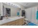Bathroom featuring a double sink vanity, a toilet, a black cabinet and a shower with a white curtain at 117 Candace Pl, Cary, NC 27513