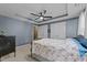 A bedroom showcases a decorative ceiling, a ceiling fan, and double closets at 117 Candace Pl, Cary, NC 27513