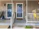 Welcoming front entrance featuring dual doors, decorative lights, and well-kept porch at 117 Candace Pl, Cary, NC 27513