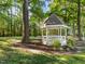 Charming gazebo nestled in a lush green space offers a peaceful retreat at 117 Candace Pl, Cary, NC 27513