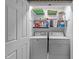 A laundry room features a washer, a dryer, and wire shelving at 117 Candace Pl, Cary, NC 27513