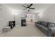 Open living space with cozy fireplace, ceiling fan and comfortable seating area at 117 Candace Pl, Cary, NC 27513