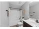 Bathroom featuring a shower-tub combo and single sink at 117 Woodlark Ln, Holly Springs, NC 27540