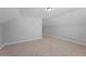 Spacious bedroom featuring neutral carpet and paint and a large walk-in closet at 117 Woodlark Ln, Holly Springs, NC 27540