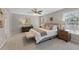 Bright main bedroom features carpeted floors, neutral decor, and plenty of natural light at 117 Woodlark Ln, Holly Springs, NC 27540