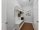 Functional mudroom boasts custom storage with cubbies, hooks, and baskets for organization at 117 Woodlark Ln, Holly Springs, NC 27540