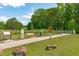 Scenic community park with walking trail, benches, bike signs and green space for outdoor activities and recreation at 1401 Everette Fields Rd, Morrisville, NC 27560