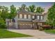 Inviting two-story home with a three-car garage, basketball hoop, and well-maintained lawn at 1401 Everette Fields Rd, Morrisville, NC 27560
