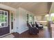 Charming front porch featuring comfortable seating, a cozy rug, and a welcoming entrance at 1401 Everette Fields Rd, Morrisville, NC 27560