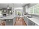 Open-concept kitchen with white countertops, ample cabinetry, and views into the dining area at 1401 Everette Fields Rd, Morrisville, NC 27560