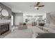 View of open concept living room and kitchen with fireplace and neutral tones at 1401 Everette Fields Rd, Morrisville, NC 27560