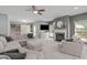 Spacious living room with large comfortable seating, fireplace and a mounted TV at 1401 Everette Fields Rd, Morrisville, NC 27560