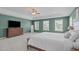 Spacious primary bedroom with tray ceilings and views of the neighborhood at 1401 Everette Fields Rd, Morrisville, NC 27560