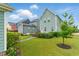 Green backyard with a lush lawn and charming landscaping at 1448 Big Falls Dr, Wendell, NC 27591
