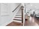 Elegant staircase leading to the upper level of the home at 1448 Big Falls Dr, Wendell, NC 27591