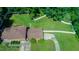 Aerial view of the home and its expansive, well-maintained yard with mature trees and fencing at 1509 Logan St, Durham, NC 27704