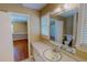 Bathroom with a sink vanity and a large mirror, providing ample space and natural light at 1509 Logan St, Durham, NC 27704