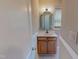 Bathroom featuring vanity with storage and decorative mirror at 1509 Logan St, Durham, NC 27704