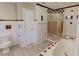 Bathroom featuring white tile, separate shower and tub with accent tiles and natural light at 1509 Logan St, Durham, NC 27704